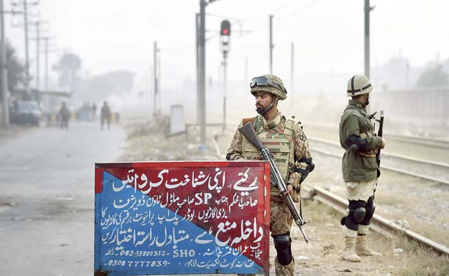 Pakistani troops stand guard following a government decision to hang around 500 militants in coming weeks. Six militants have been hanged since December 19, amid rising public anger over the December 16 attack on a Peshawar school. Pic/AFP