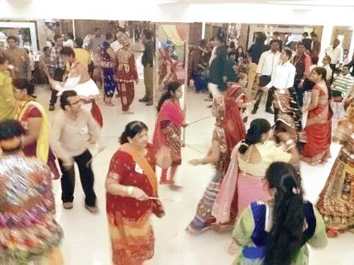 Navratri Navyuvak Mandal members dance at the Dussehra celebration for the deaf