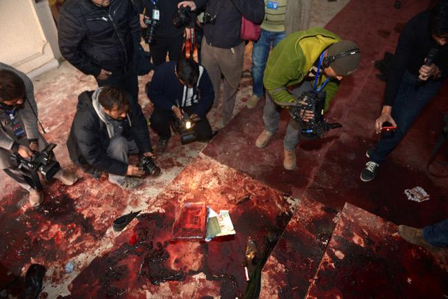 Pakistan media shoot footage of the bloodied floor at an army-run school a day after an attack by Taliban militants in Peshawar on Wednesday. Pakistan began three days of mourning on December 17 for the 132 schoolchildren and nine staff killed by the Taliban in the country