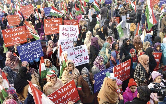 Pakistan Awami Tehreek (PAT) activists in a rally in Lahore for the victims of the Peshawar school massacre. Al-Qaeda’s regional branch said on Sunday that its hearts were “bursting with pain” over the Taliban’s massacre at a Pakistan school, and urged the militants to target only security forces. Pic/AFP