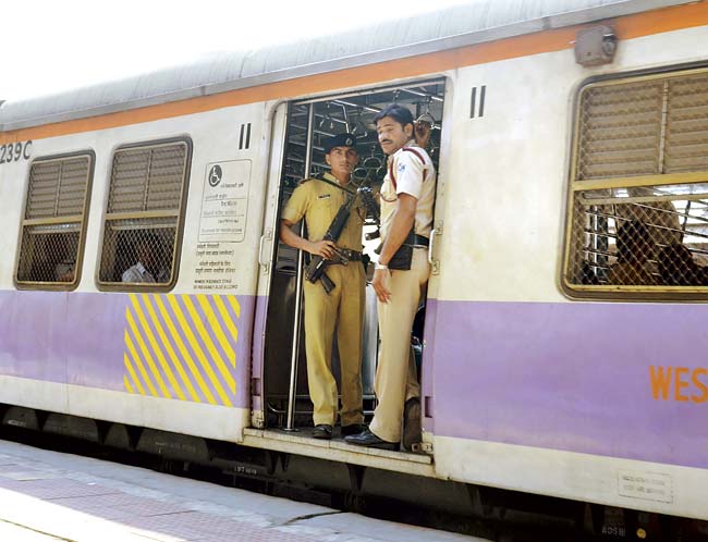 Armed RPF personnel guard a ladies compartment of a local train. File pic for representation