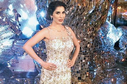 Sophie Choudry walks the ramp for a friend