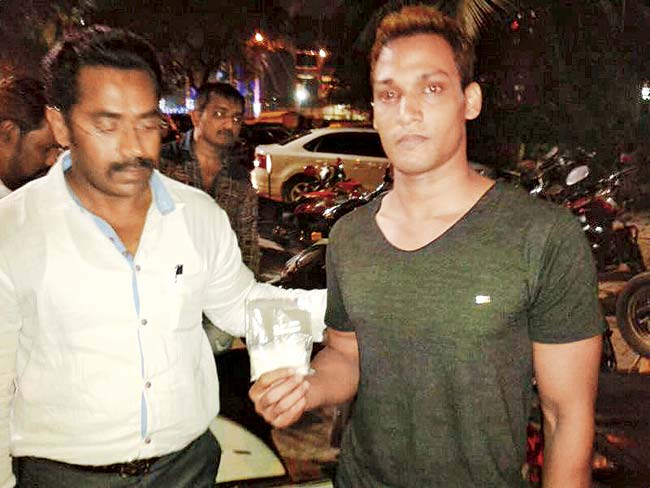 Sunil Sharma, the delivery man (in t-shirt), was nabbed with 18 packets of the drug outside a college in Andheri (West)