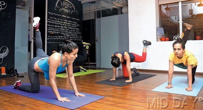 The session makes most of a variety of butt lifts and plank positions to work on your core muscles