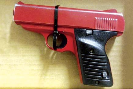 Man paints loaded handgun red to fool cops