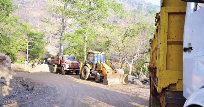 The alleged widening of the road being carried out by the ashram officials in 2012. File pic