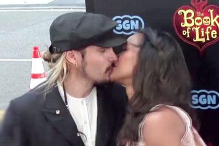 Zoe Saldana shares a kiss with Marco Perego 