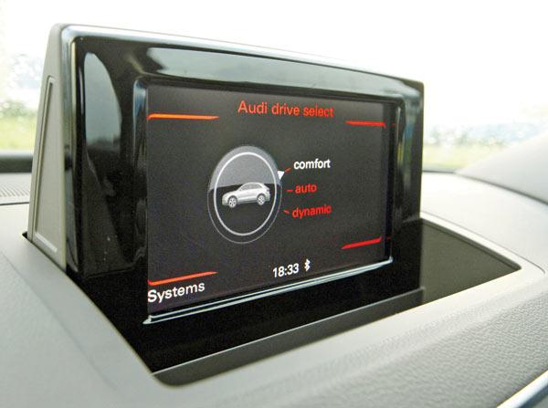 The push-to-pop screen above the central screen allows control over the car’s features, including Drive Select using Audi’s MMI interface