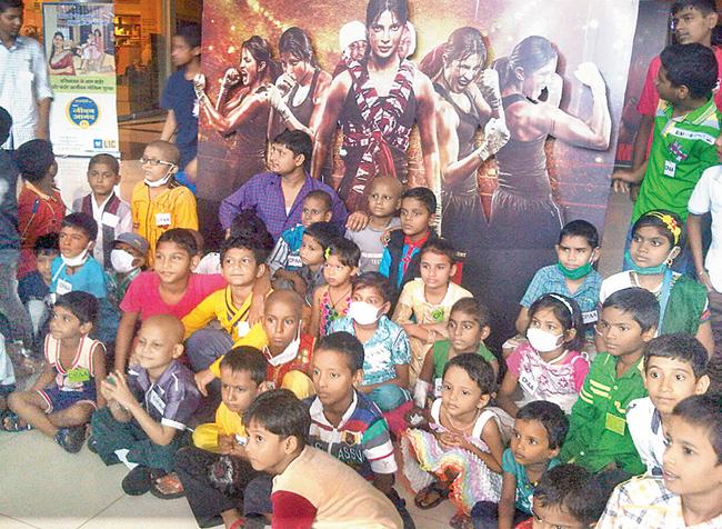 Cancer-afflicted children watching a screening of Mary Kom in Mumbai