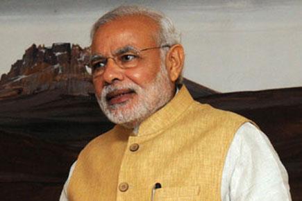 Prime Minister Narendra Modi greets people on Chhath