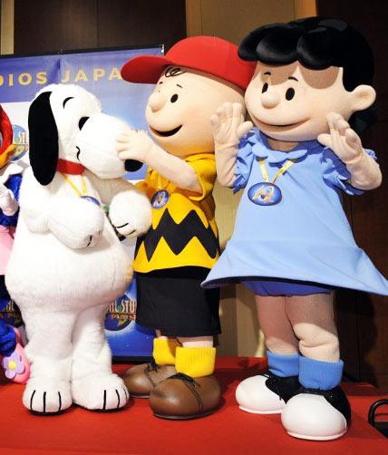 Performers wearing costumes as Snoopy, Charlie Brown and Lucy at an event in Japan. Pic/AFP