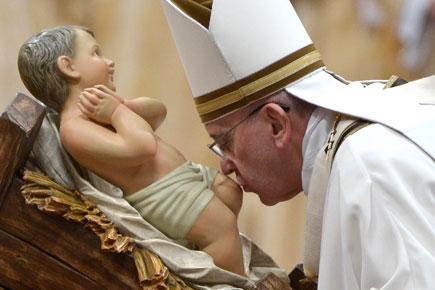 Pope urges 'tenderness' as millions fete Christmas