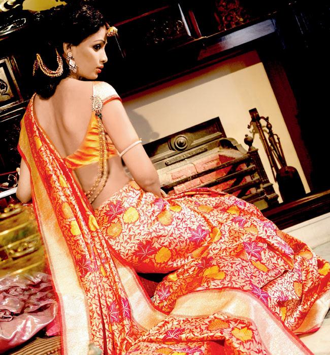 A model showcases a saree by SNNA
