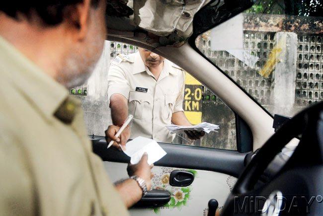 RTO officials check taxi meters after recalibration. PIC/PRADEEP DHIVAR