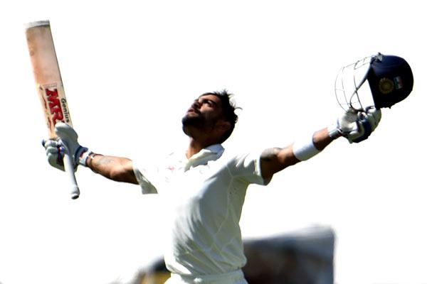 Virat Kohli celebrates as he reaches to his century during the final day of the first cricket Test match between Australia and India at the Adelaide Oval on December 13, 2014. AFP PHOTO
