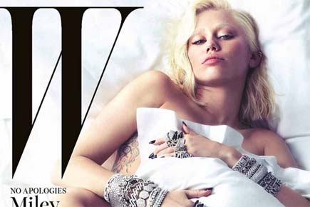 'Unrecognizable' Miley Cyrus poses naked for a magazine's cover