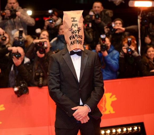 Shia LaBeouf with a paper bag mask