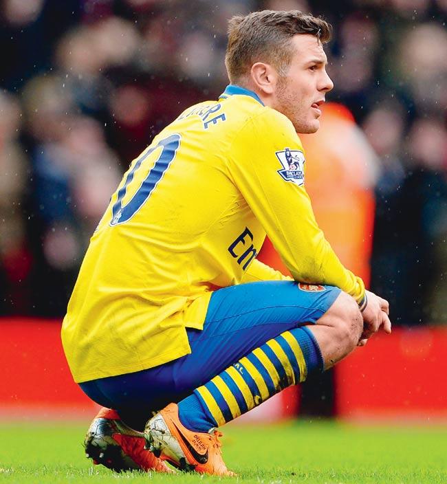 A dejected Jack Wilshere of Arsenal after the loss to Liverpool on February 8 at Anfield. Pic/Getty Images