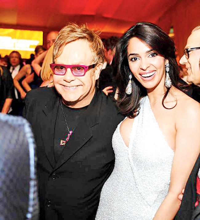 Seen here with award-winning singer, Sir Elton John, whom she met in December 2012