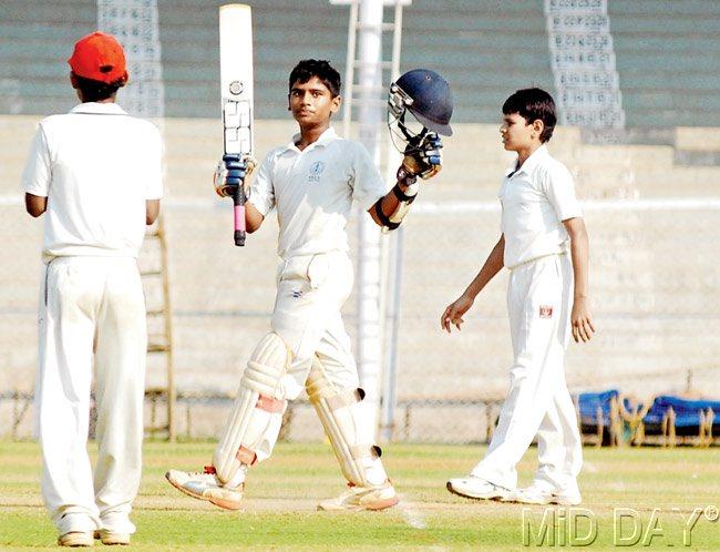 Suved Parkar celebrates his century against Al-Barkaat at CCI yesterday. Pic/Shadab Khan