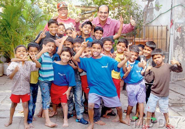 Big boost: MiD DAY reader Himanshu Kapadia (in pink shirt) at the St Catherine of Siena Orphanage in Bandra where he handed over a cheque of Rs 10,000 on Saturday . Pic/Shadab Khan