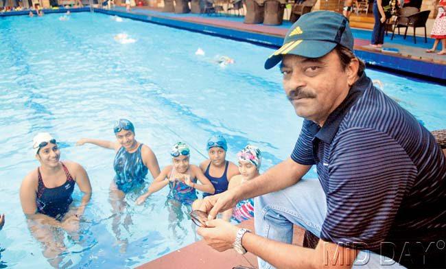 Shiv Chhatrapati awardee swimming coach Subodh Danke with his wards at the Khar Gymkhana last week. Pic/Pradeep Dhivar