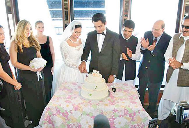 The bridal couple Veena Malik and Asad Bashir Khan Khattak (centre) with family  and friends