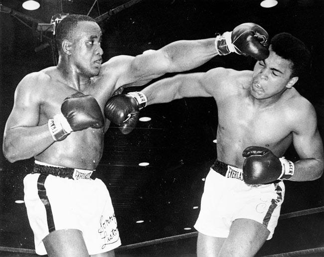 Cassius Clay, later known as Muhammad Ali, (left) lands a right hook on Sonny Liston