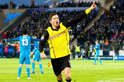 Borussia Dortmunds Robert Lewandowski celebrates after scoring a goal against Zenit Saint Petersburg during their UEFA Champions League Champions League last 16, first-leg football match at Petrovsky Stadium in Russias second city of Saint Petersburg. Pic