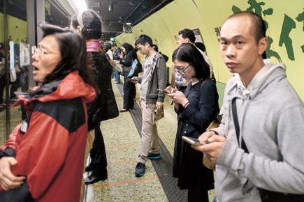 No sitting! Hong Kong trains to scrap seats for smartphone users 