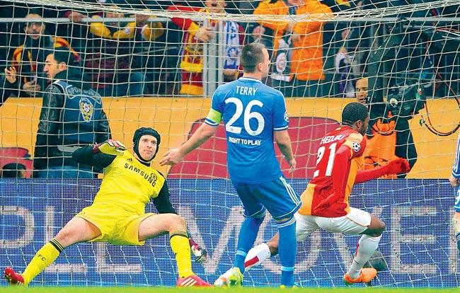 Galatasaray Aurelien Chedjou (right) scores past Petr Cech at Istanbul’s Ali Sami Yen Arena on Wednesday. Pic/Getty Images