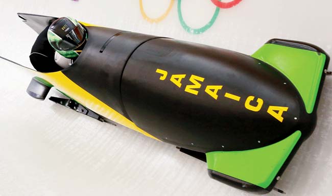 Jamaican bobsledder Winston Watts pilots a bobsleigh during a practice run at the Sanki Sliding Center yesterday. Pic/Getty Images