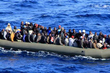 Italy rescues 1,100 boat migrants, warns of surge 