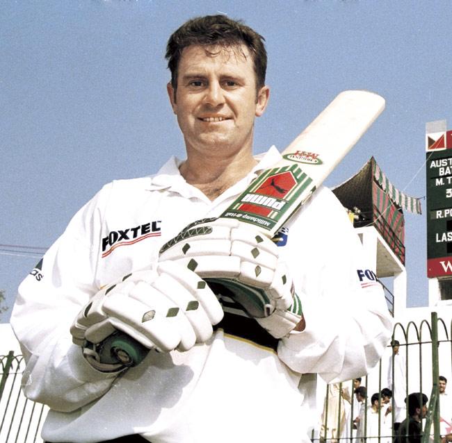 Australia captain Mark Taylor poses for cameramen after his record-equalling score of 334 against Pakistan in Peshawar in 1998. Taylor stayed unbeaten and declared the innings closed at 599 for four