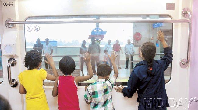 Small children were excited as they travelled by the monorail. Irrespective of their age, Mumbaikars flocked to the stations for a ride on the brand new mode of transport yesterday. Pic/Bipin Kokate