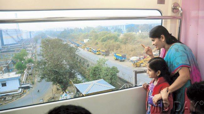 Mother and daughter enjoy their time aboard the country’s first-ever monorail after boarding it from Wadala. Pic/Bipin Kokate