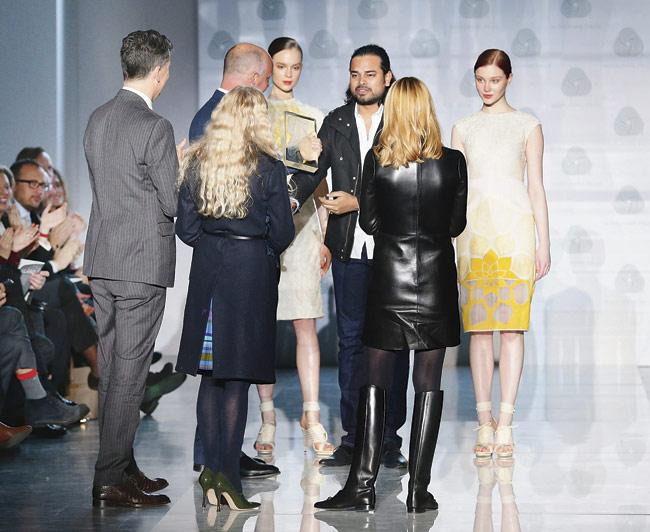Rahul Mishra receives the International Woolmark Prize for his Autum/Winterwear collection during the Milan Fashion Week