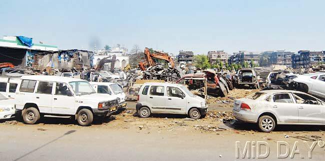 Cars whose parts have been stolen are dumped at a graveyard at Kurla. Pic/Sameer Markande