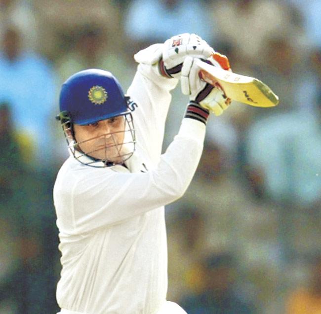 Virender Sehwag hits a boundary during Day One of the opening Test against Pakistan at Multan on March 28, 2004. In 2008, Sehwag scored 319 against SA in Chennai