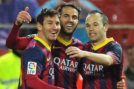 Messi double takes Barcelona back to top of La Liga