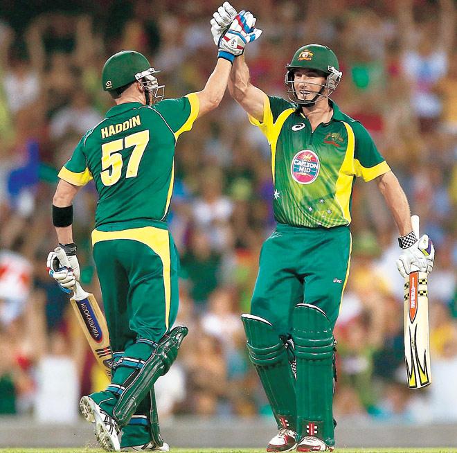 Australia’s Brad Haddin and Shaun Marsh (right) celebrate their win in the third ODI against England yesterday. Pic/Getty Images