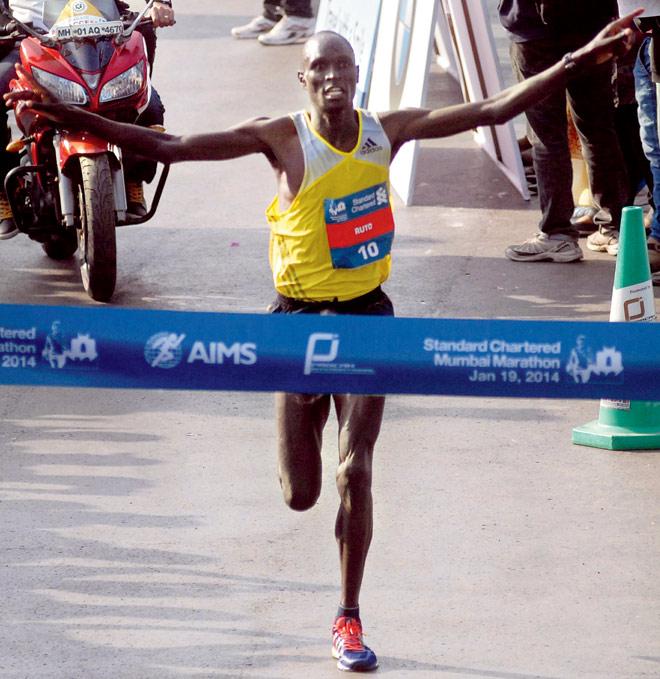 no 1: Kenya’s Evans Ruto crosses the finish to win the Mumbai Marathon yesterday.  Pic/Atul Kamble
