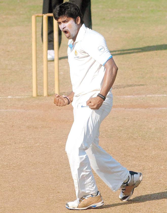 Karnataka’s Vinay Kumar celebrates  a wicket.  File Pic
