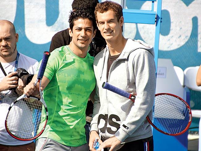 Muzammil Ibrahim (left) with Andy Murray