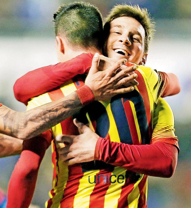 Barcelona forward Cristian Tello (left) celebrates his third goal with teammate Lionel Messi. Pic/AFP