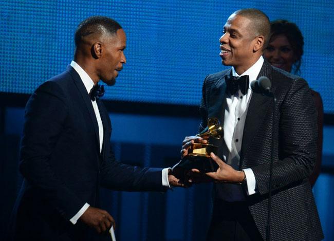Jamie Foxx presents the award to Jay Z, winner of the Best Rap/Sung Collaboration during the 56th Grammy Awards at the Staples Center in Los Angeles