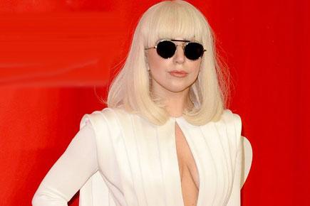 Gaga flashes side breasts at awards