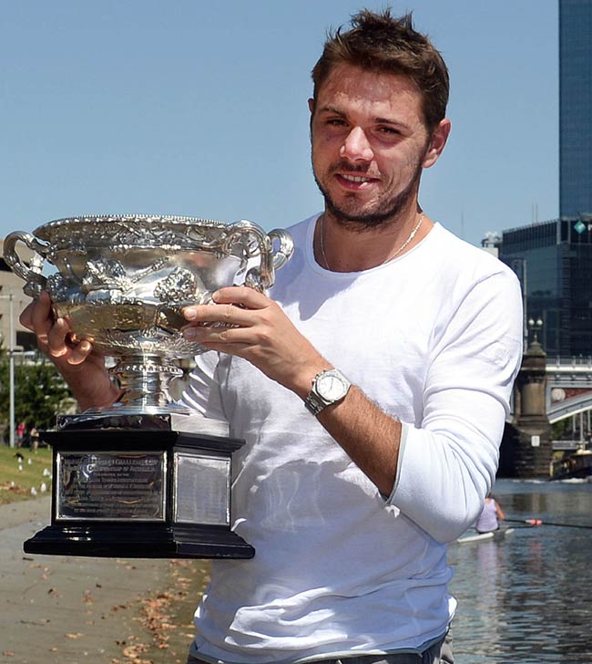 Stanislas Wawrinka of Switzerland poses with the trophy on the bank of the Yarra river in Melbourne. Pic/AFP
