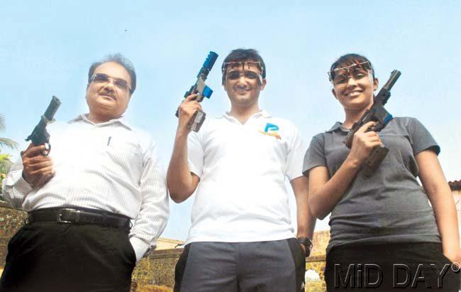 Goldfingers: Ashok Pandit (left) with his son Ronak and daughter-in-law Heena Sidhu at Worli’s Maharashtra Rifle Association shooting range before they left for the shooting trials in New Delhi. Pic/Atul Kamble