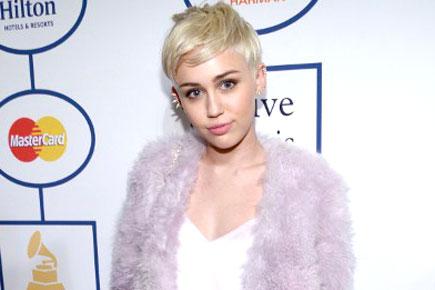 Miley Cyrus plays Guitar Hero at home after being snubbed at Grammys
